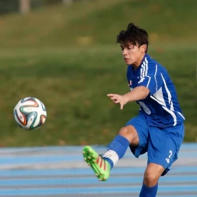 football player kicking a ball